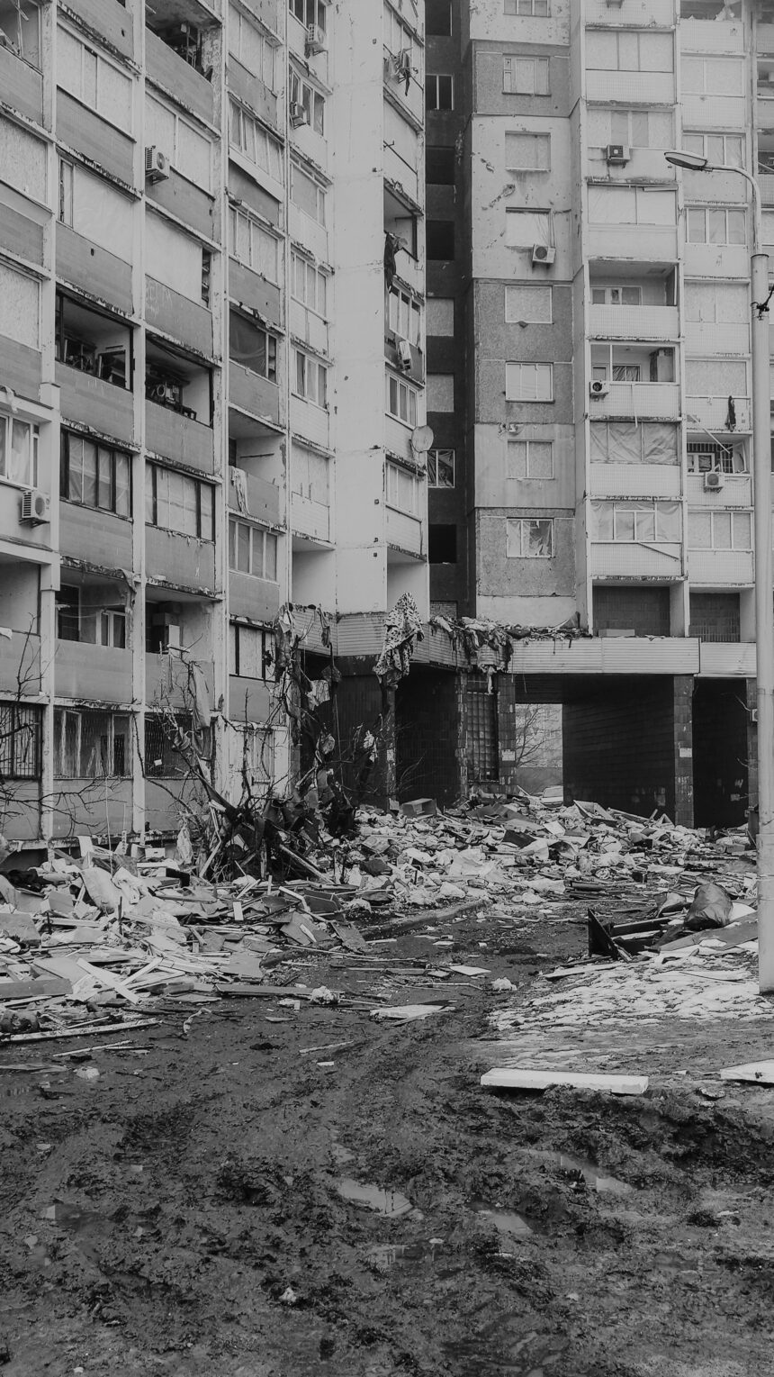 A black and white photo of a city bombed due to terrorism