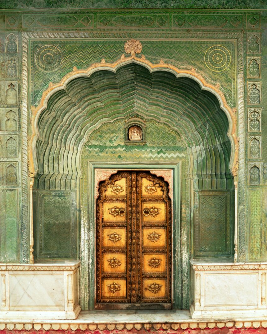 A green palace in India with a gold door